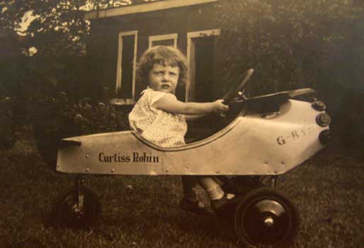 Jane in toy airplane